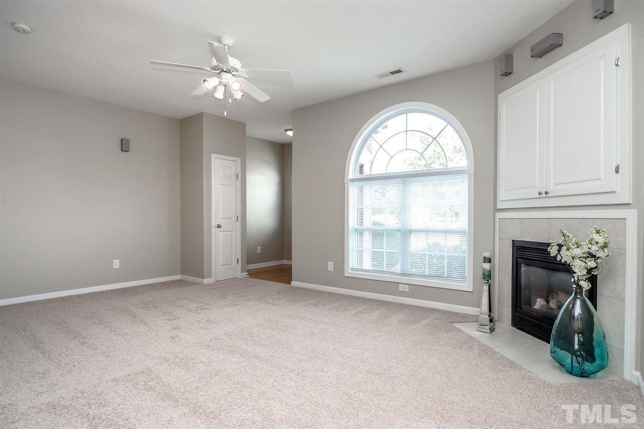 2041 Rivergate Road, Unit 105 Raleigh, NC 27614 - Photo 3 of 9 a view of an empty room with a fireplace