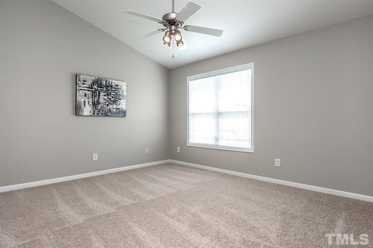 2041 Rivergate Road, Unit 105 Raleigh, NC 27614 - Photo 5 of 9 a view of an empty room with a window