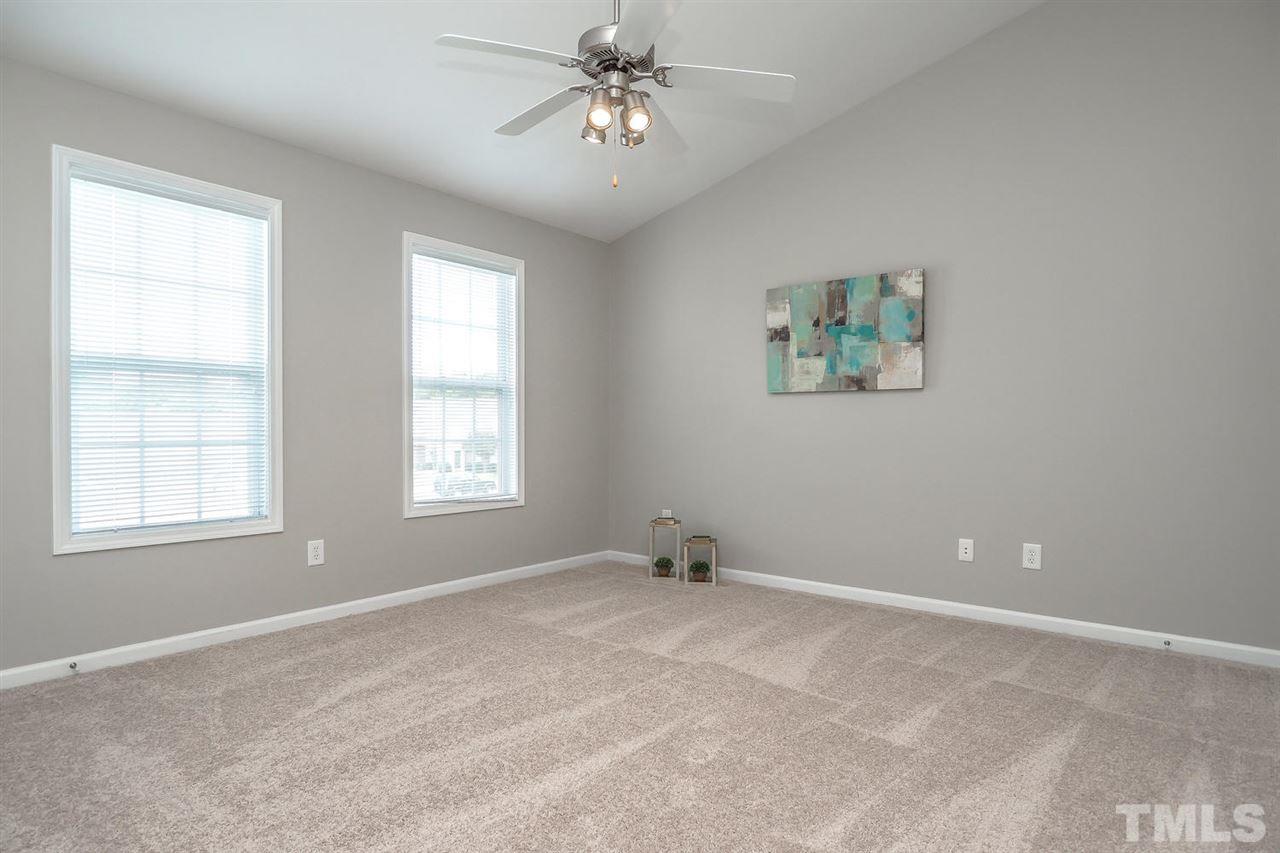 2041 Rivergate Road, Unit 105 Raleigh, NC 27614 - Photo 7 of 9 a view of an empty room with a window