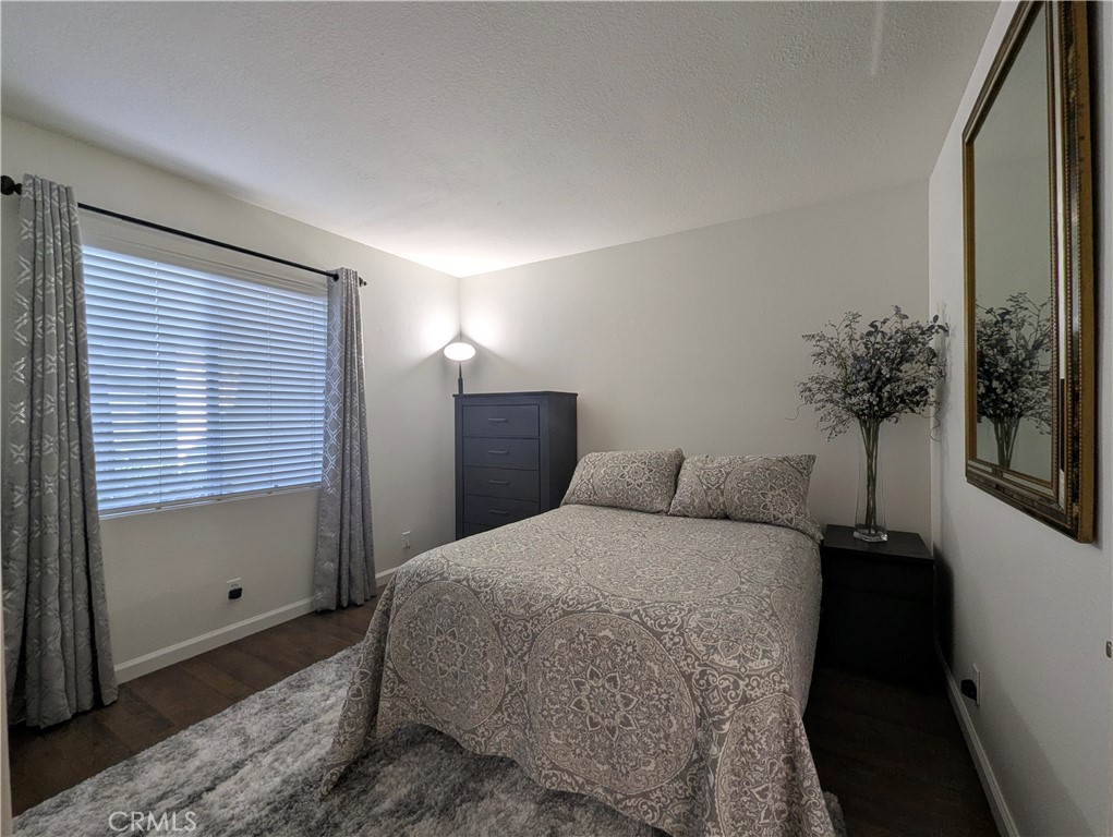 73 Brisa Del Lago Rancho Santa Margarita, CA 92688 - Photo 2 of 12 a bedroom with a bed and a window