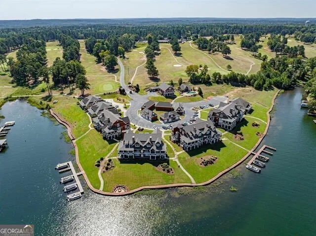 an aerial view of a house with outdoor space swimming pool and lake view