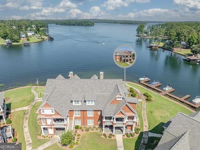 an aerial view of a house with a lake view