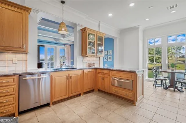 a bedroom with a bed a chair and a large window