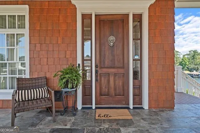a view of a dining room with furniture wooden floor and chandelier