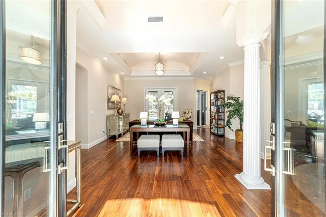 a view of a dining room with furniture and wooden floor
