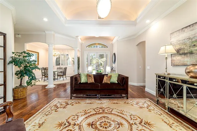 a large kitchen with stainless steel appliances granite countertop wooden cabinets a sink dishwasher a stove and a refrigerator