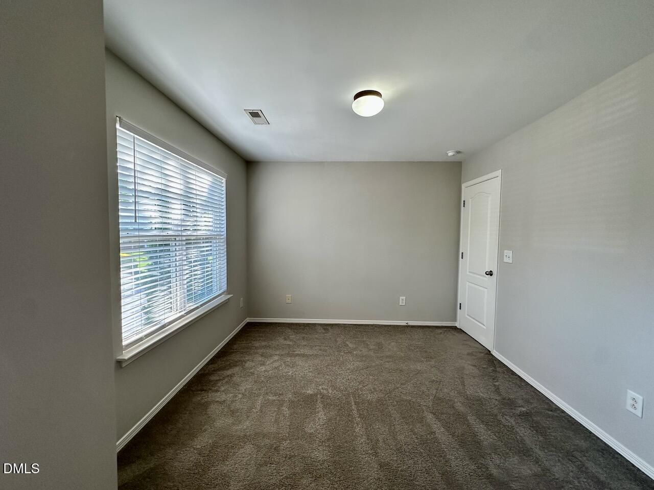 8208 Stone Cellar Drive Raleigh, NC 27613 - Photo 26 of 34 a view of an empty room with a window