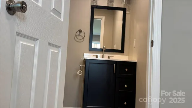 a view of a bathroom from a hallway