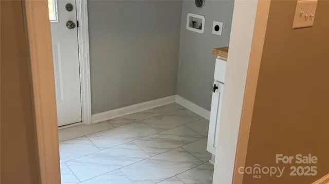 a view of a door and a window