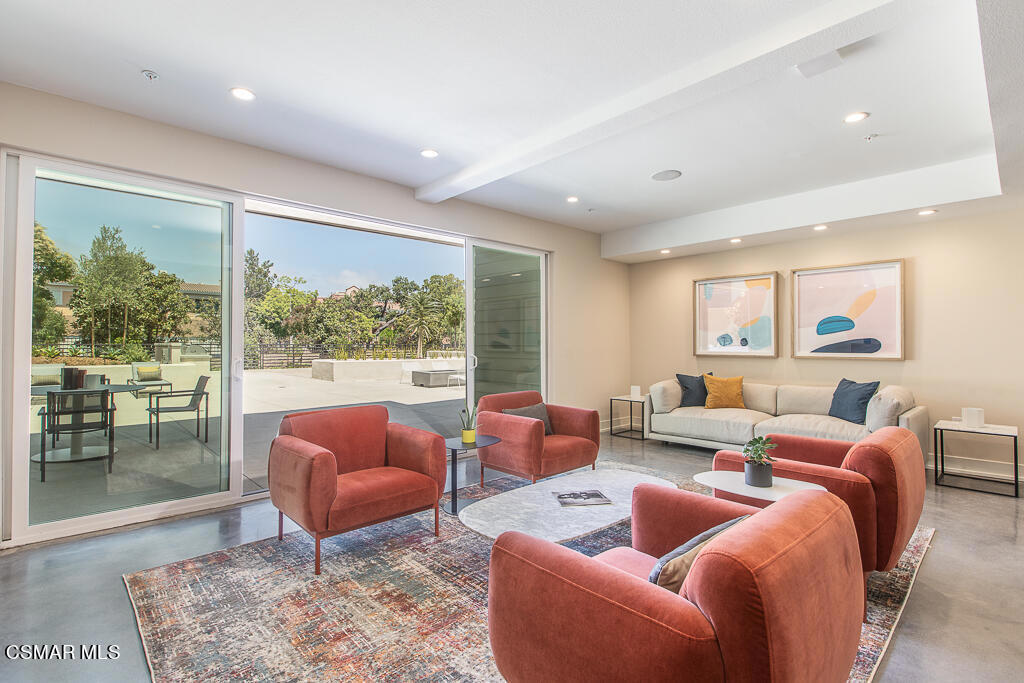 77 North Conejo School Road, Unit 217 Thousand Oaks, CA 91362 - Photo 11 of 15 a living room with furniture and a large window