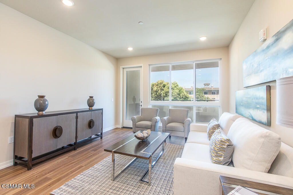 77 North Conejo School Road, Unit 217 Thousand Oaks, CA 91362 - Photo 2 of 15 a living room with furniture and a window