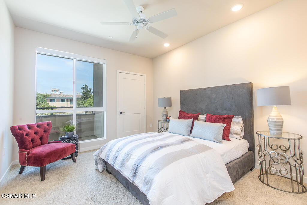 77 North Conejo School Road, Unit 217 Thousand Oaks, CA 91362 - Photo 3 of 15 a bedroom with a bed and a couch