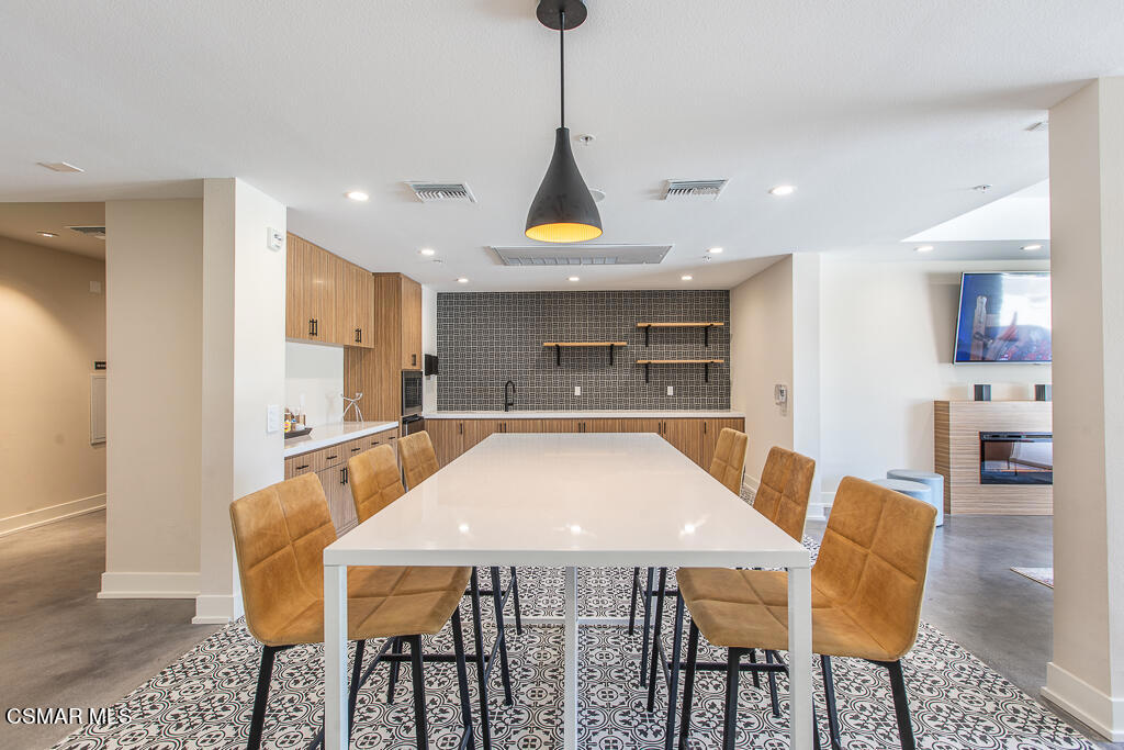 77 North Conejo School Road, Unit 217 Thousand Oaks, CA 91362 - Photo 10 of 15 a view of a dining room with furniture and wooden floor