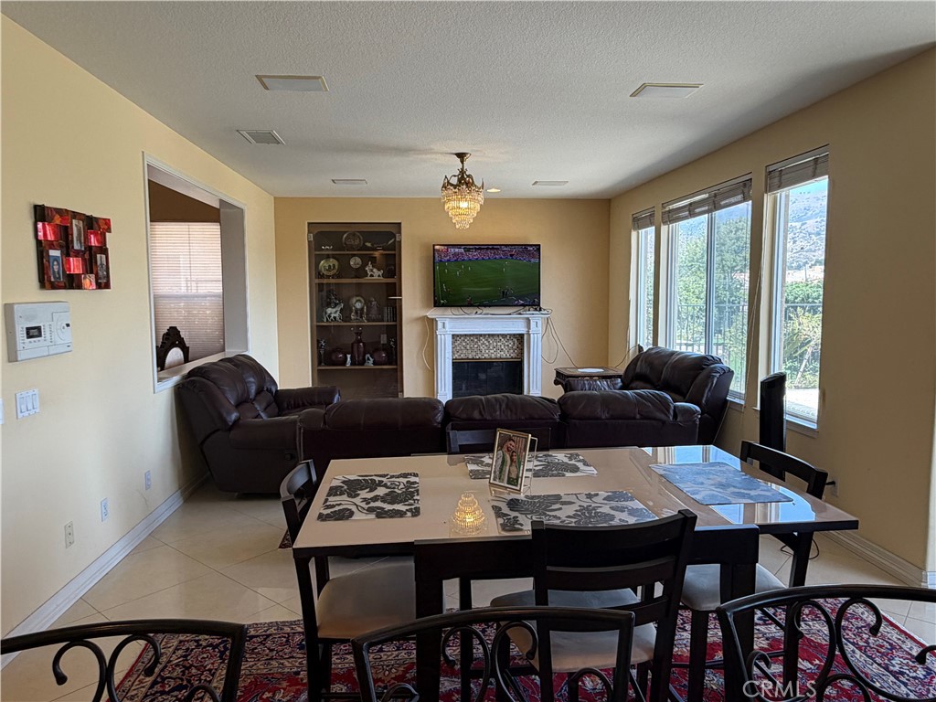 19823 Mariposa Pines Way Porter Ranch, CA 91326 - Photo 14 of 50 a view of a dining room with furniture window and outside view
