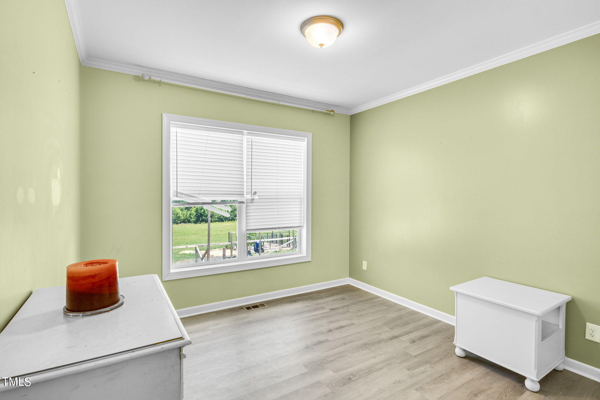 3218 Old N C 75 Stem, NC 27581 - Photo 15 of 35 a room with a wooden floor and a window