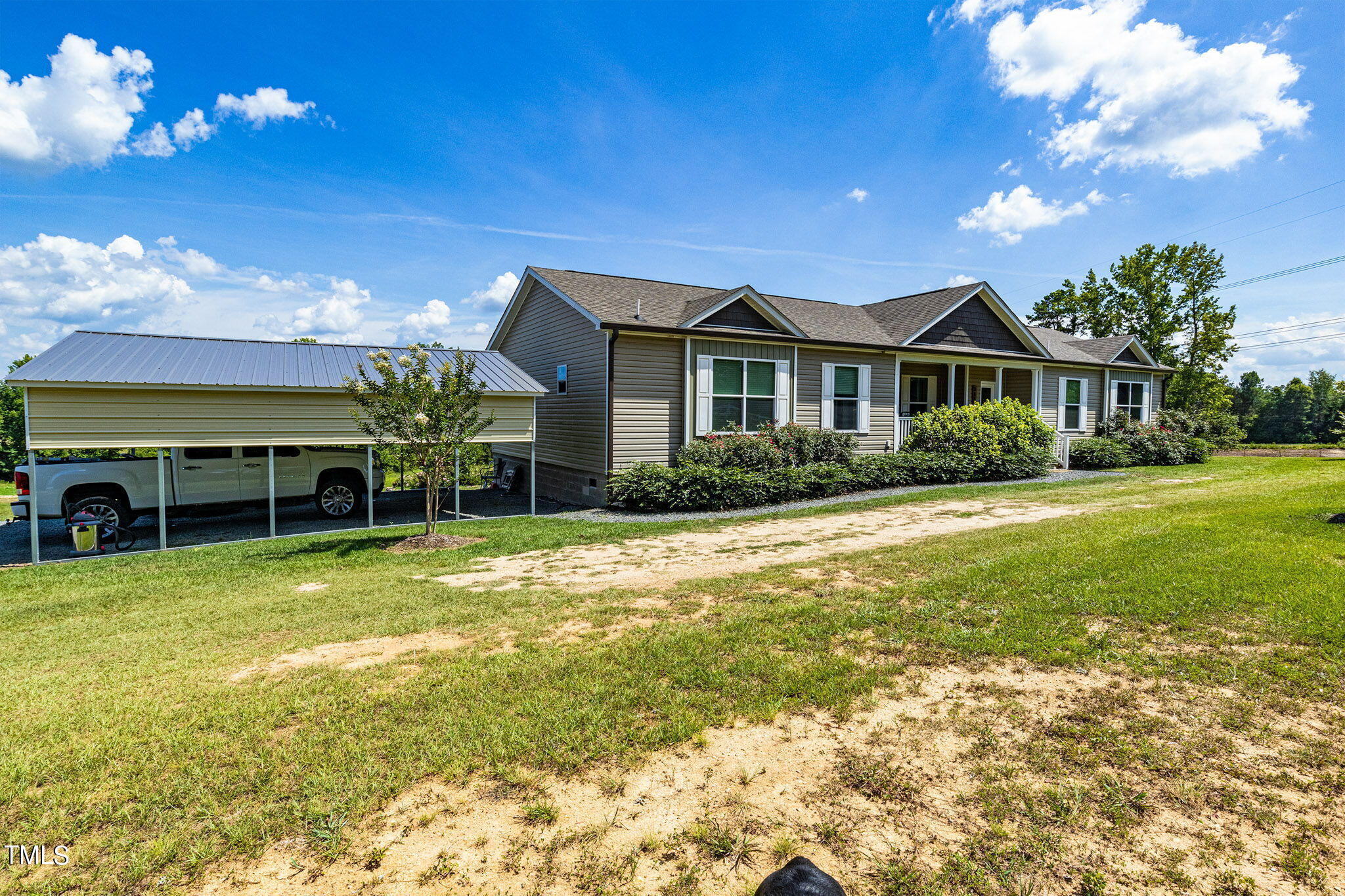 3218 Old N C 75 Stem, NC 27581 - Photo 33 of 35 a front view of house with yard and outdoor seating