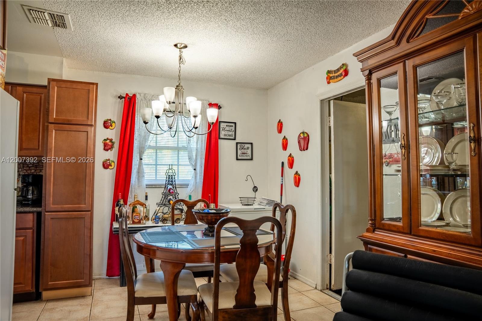 6924 Holly Creek Road Mount Dora, FL 32757 - Photo 14 of 25 a view of a dining room with furniture window and outside view