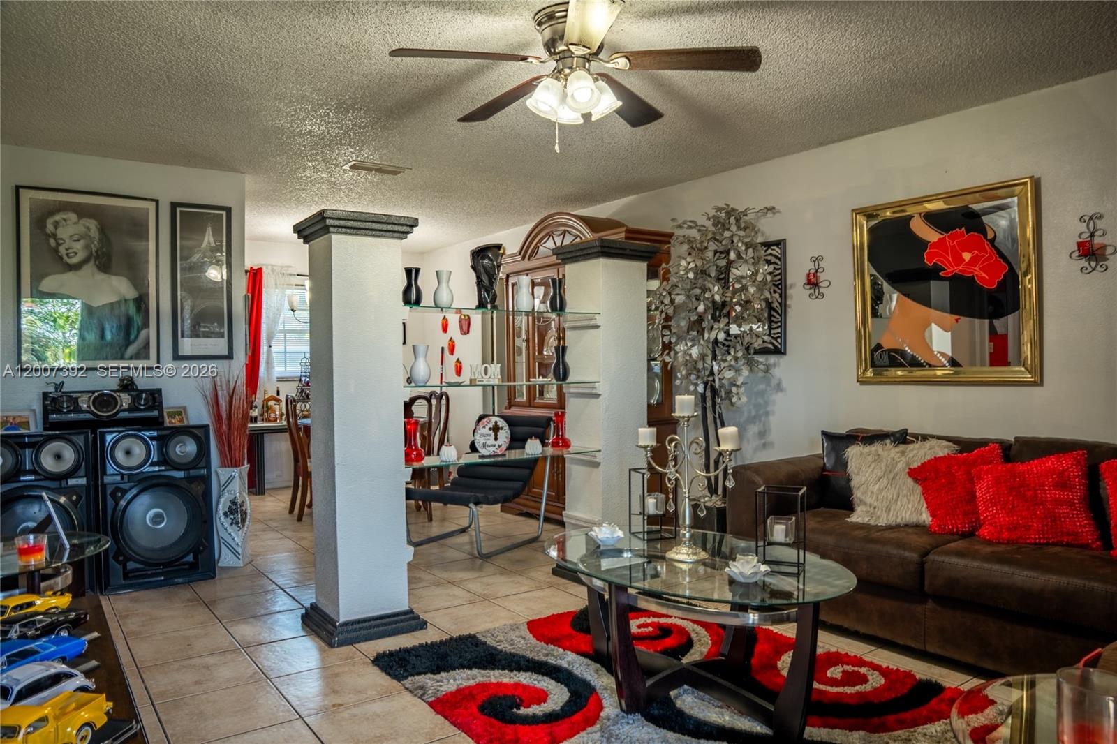 6924 Holly Creek Road Mount Dora, FL 32757 - Photo 18 of 25 a living room with lots of furniture and white walls