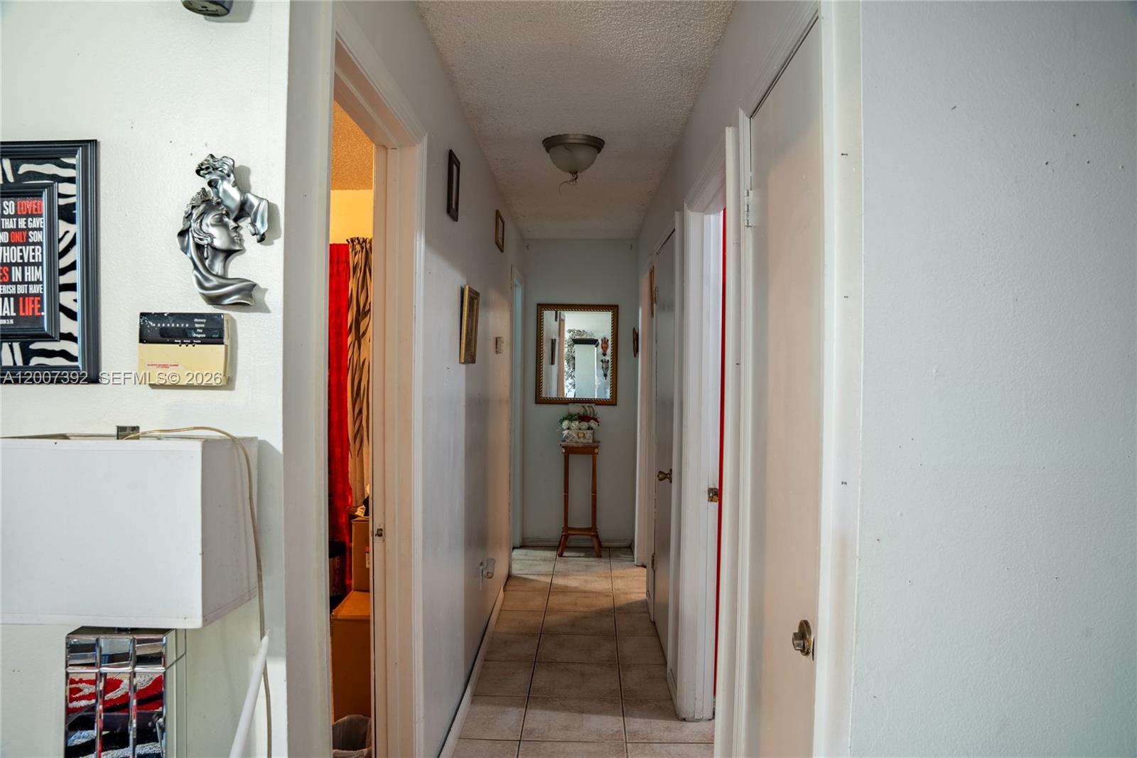 6924 Holly Creek Road Mount Dora, FL 32757 - Photo 8 of 25 a view of a hallway with wooden shelves