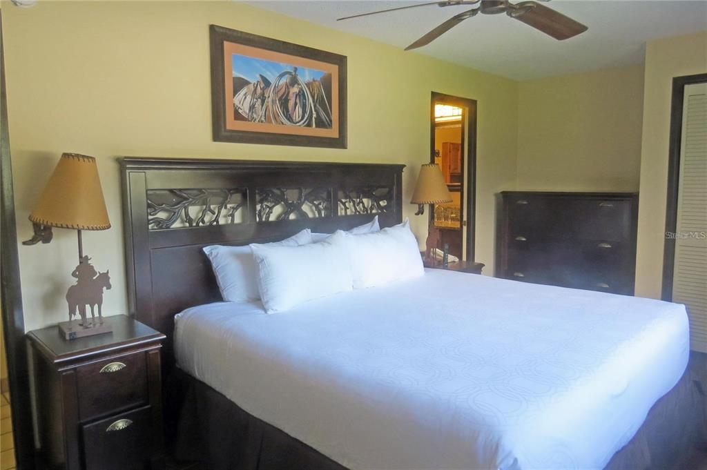 454 Cottage Circle, Unit 454 River Ranch, FL 33867 - Photo 14 of 27 a large bed in a bedroom next to a window