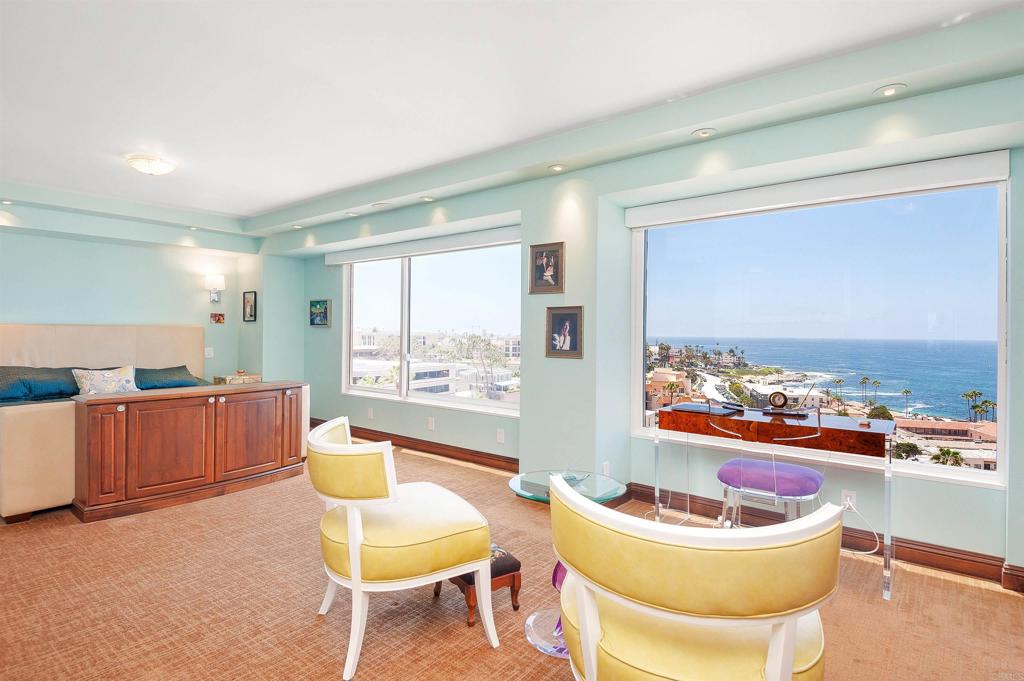 939 Coast Boulevard La Jolla, CA 92037 - Photo 16 of 36 a living room with furniture and a large window