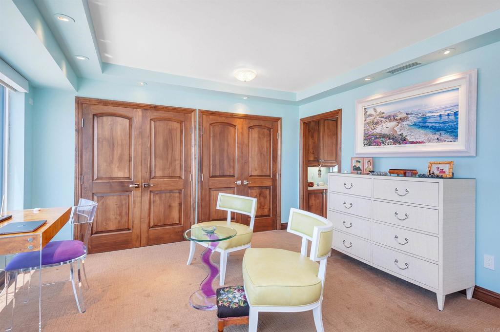 939 Coast Boulevard La Jolla, CA 92037 - Photo 18 of 36 a living room with furniture and wooden floor