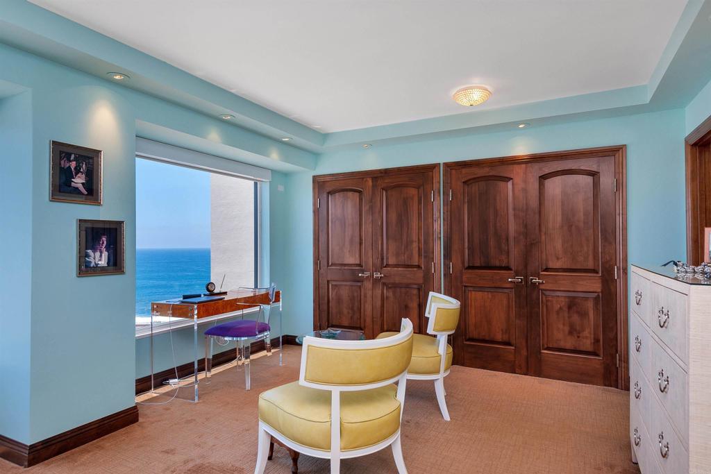 939 Coast Boulevard La Jolla, CA 92037 - Photo 19 of 36 a room with furniture a rug and a window