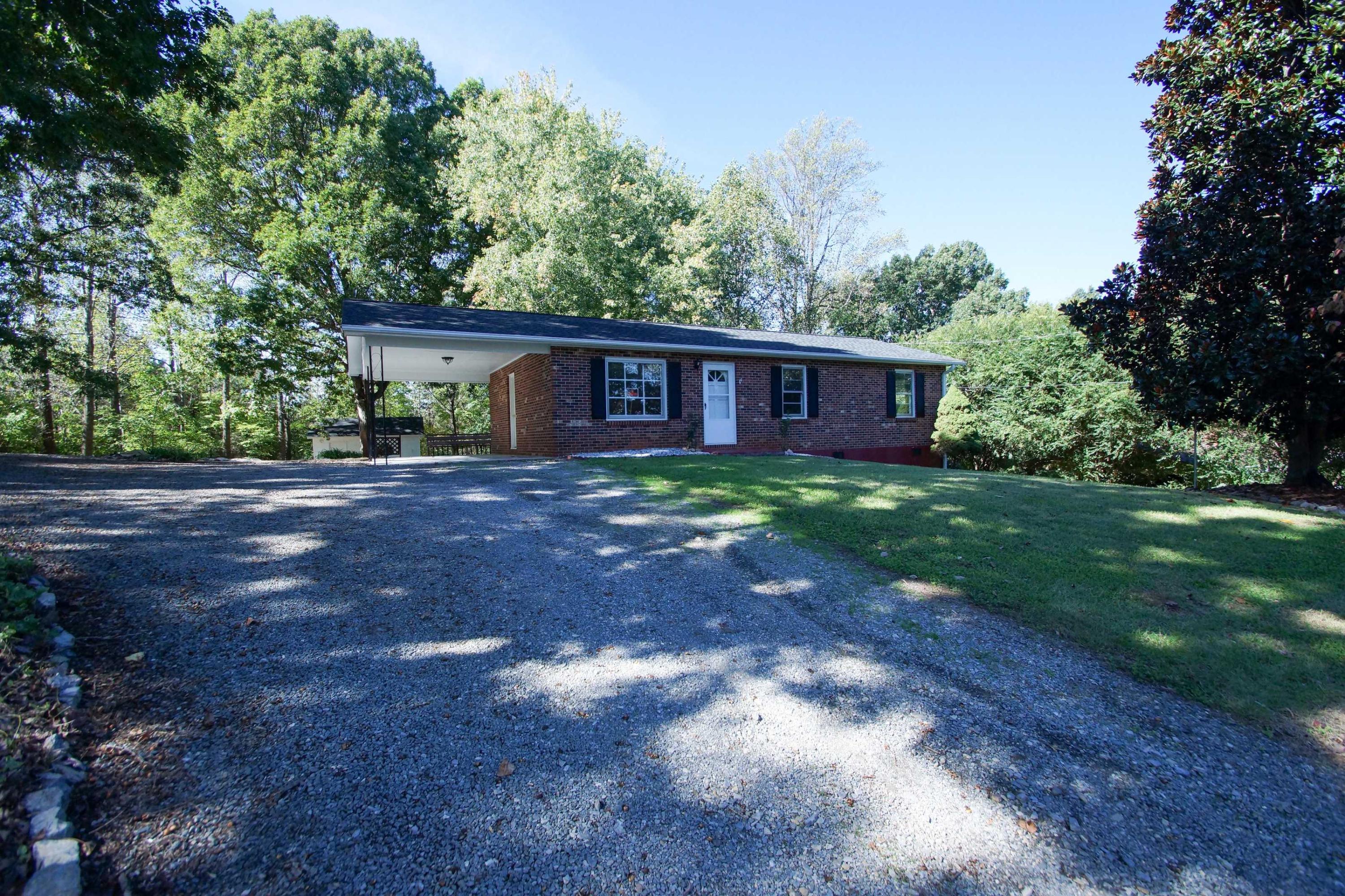 361 Power Dam Road Rocky Mount, VA 24151 - Photo 2 of 25 a view of a house with yard and a garden