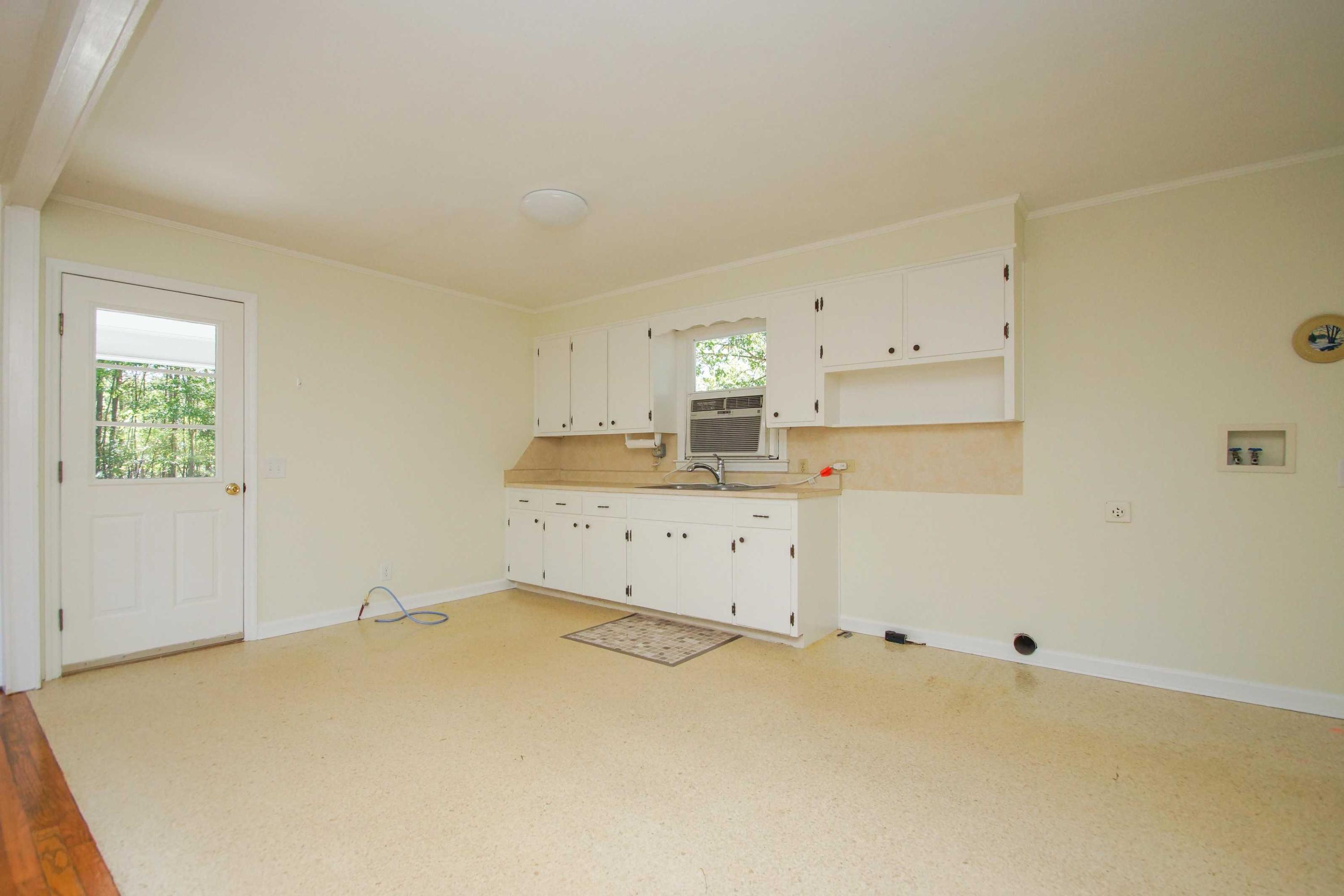 361 Power Dam Road Rocky Mount, VA 24151 - Photo 15 of 25 a bed room with a bed and a cabinets