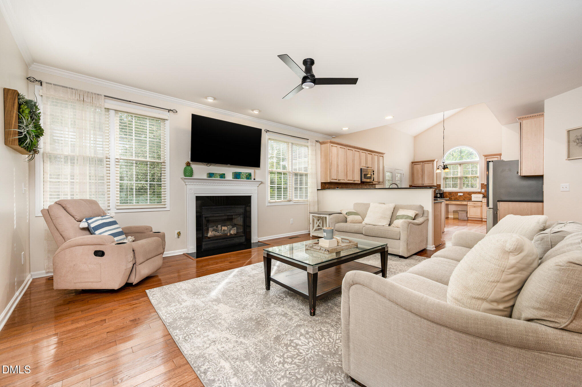 2116 Covered Bridge Court Raleigh, NC 27614 - Photo 11 of 36 a living room with furniture flat screen tv and a fireplace