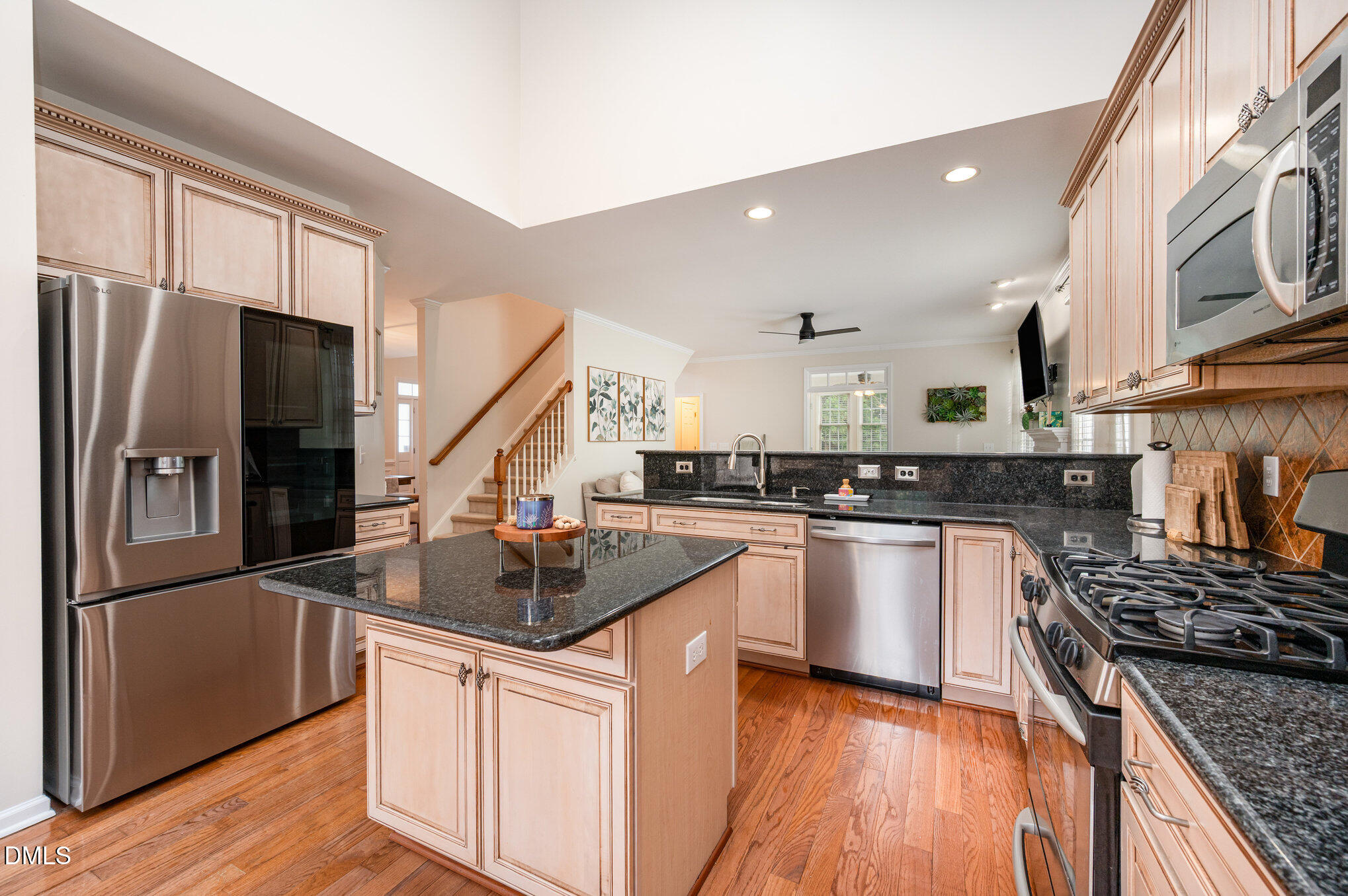 2116 Covered Bridge Court Raleigh, NC 27614 - Photo 15 of 36 a kitchen with stainless steel appliances granite countertop a sink stove and refrigerator