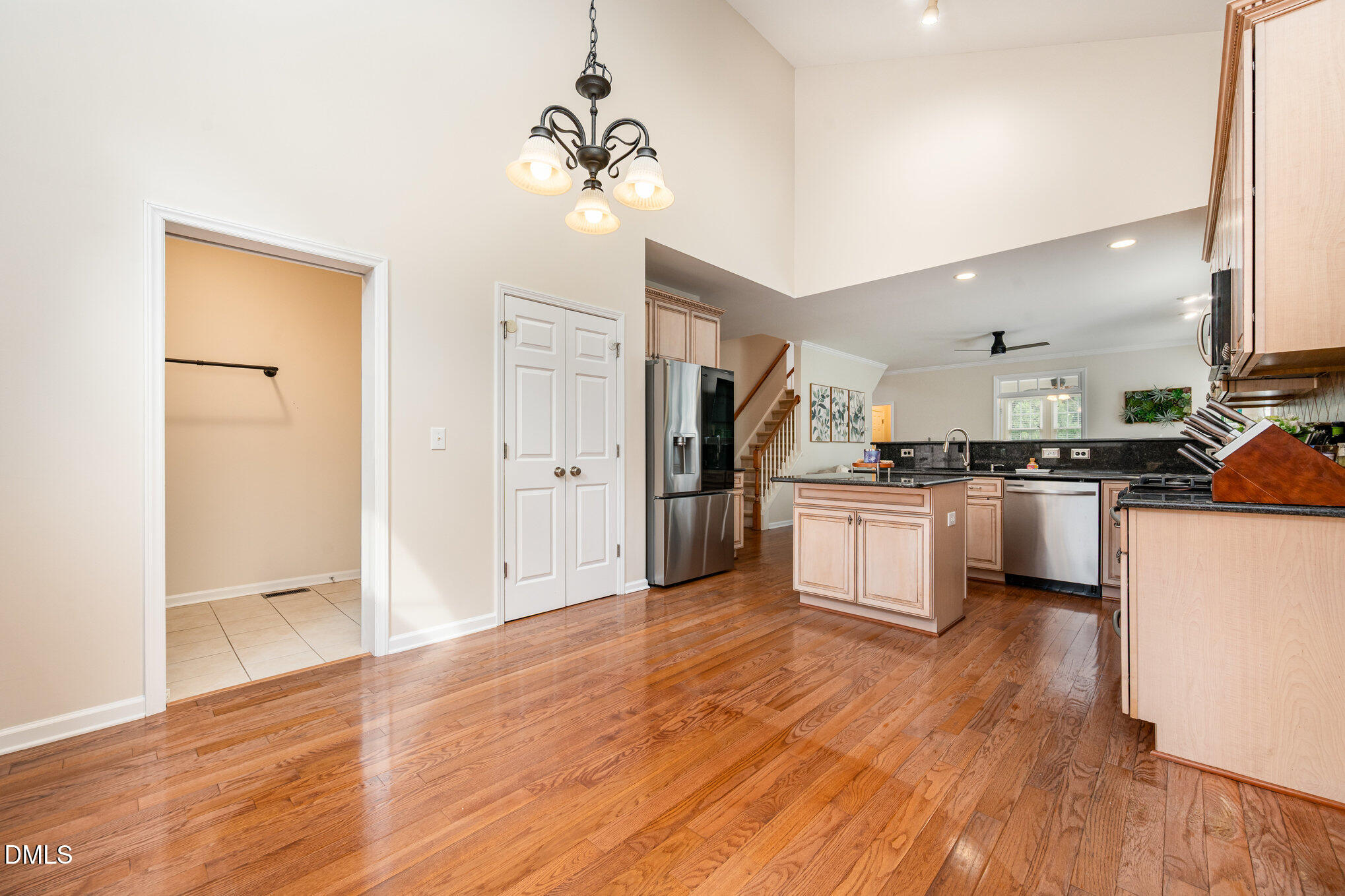 2116 Covered Bridge Court Raleigh, NC 27614 - Photo 17 of 36 a kitchen with white cabinets and stainless steel appliances