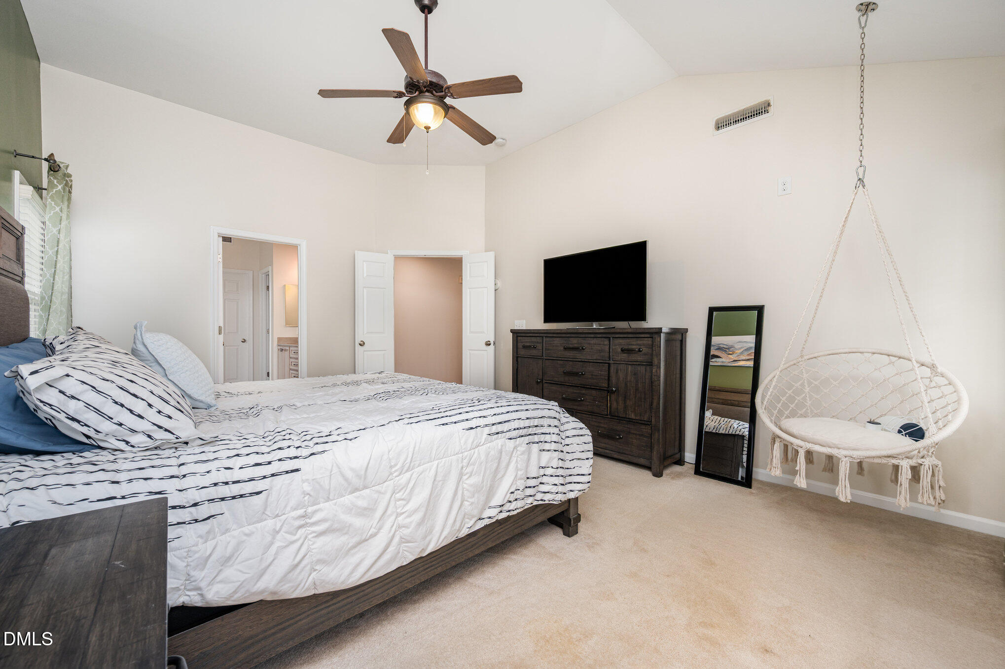 2116 Covered Bridge Court Raleigh, NC 27614 - Photo 21 of 36 a bedroom with a bed and a flat screen tv