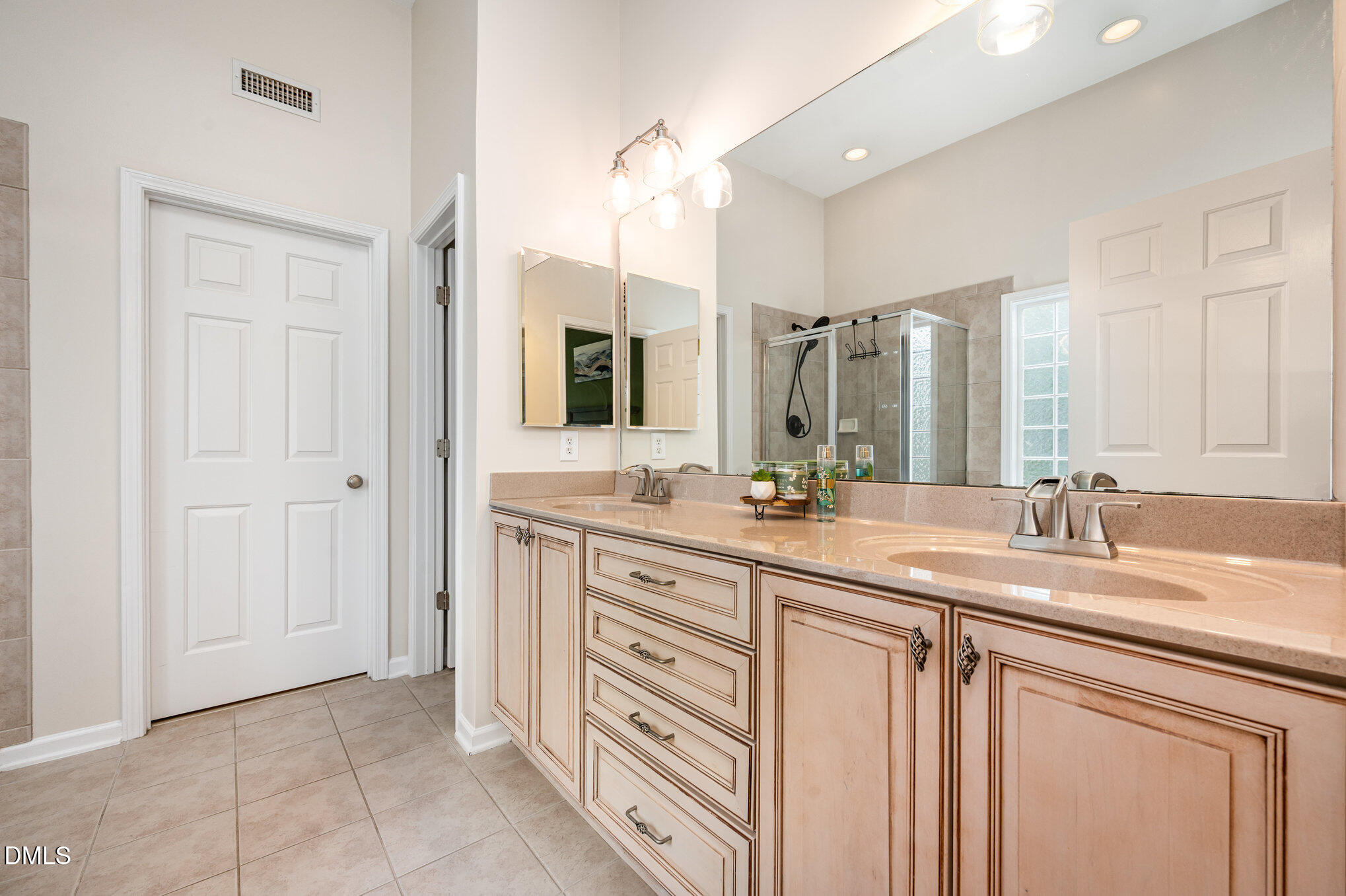 2116 Covered Bridge Court Raleigh, NC 27614 - Photo 22 of 36 a bathroom with a granite countertop sink mirror and double
