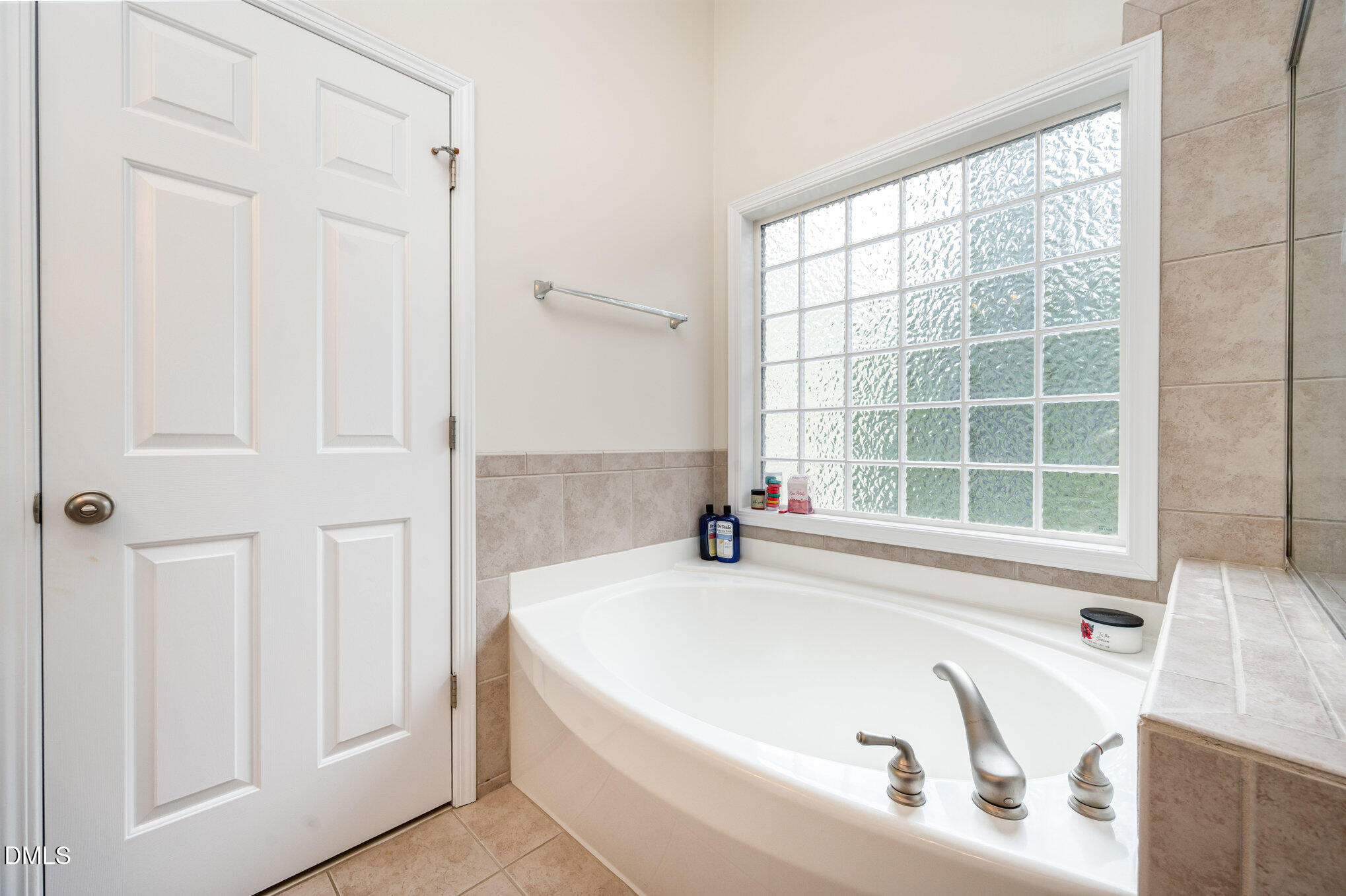 2116 Covered Bridge Court Raleigh, NC 27614 - Photo 23 of 36 a white bath tub sitting next to a window