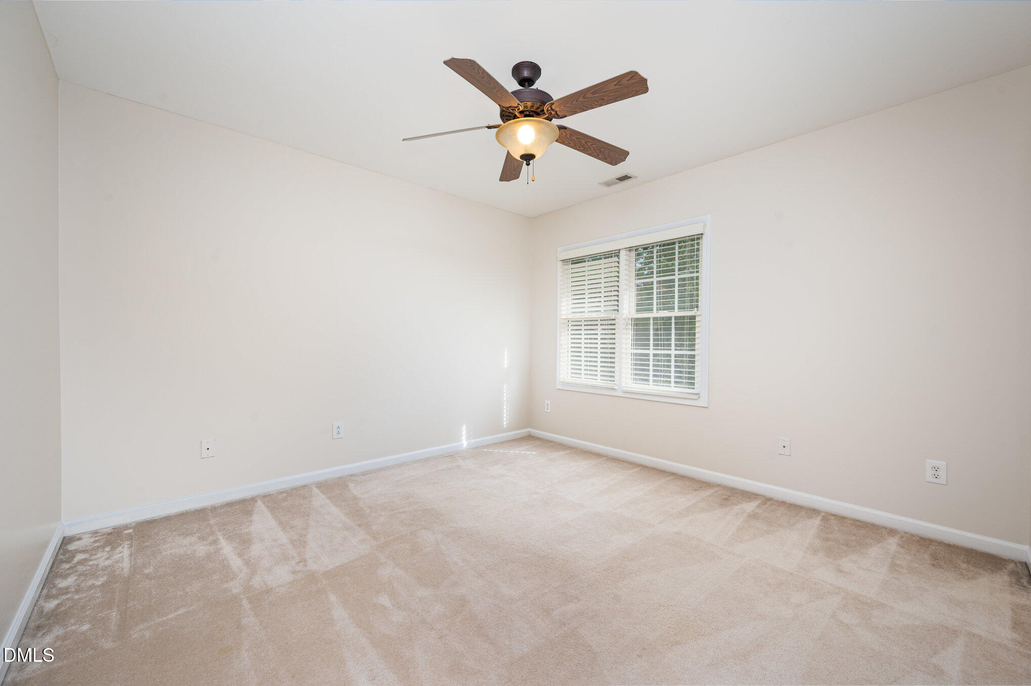 2116 Covered Bridge Court Raleigh, NC 27614 - Photo 24 of 36 an empty room with ceiling fan and window