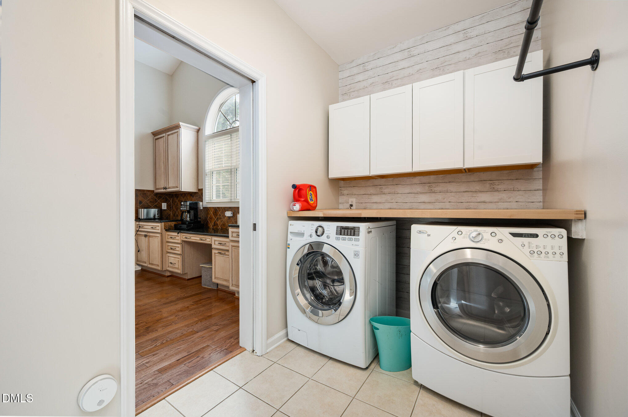 2116 Covered Bridge Court Raleigh, NC 27614 - Photo 29 of 36 a utility room with sink dryer and washer