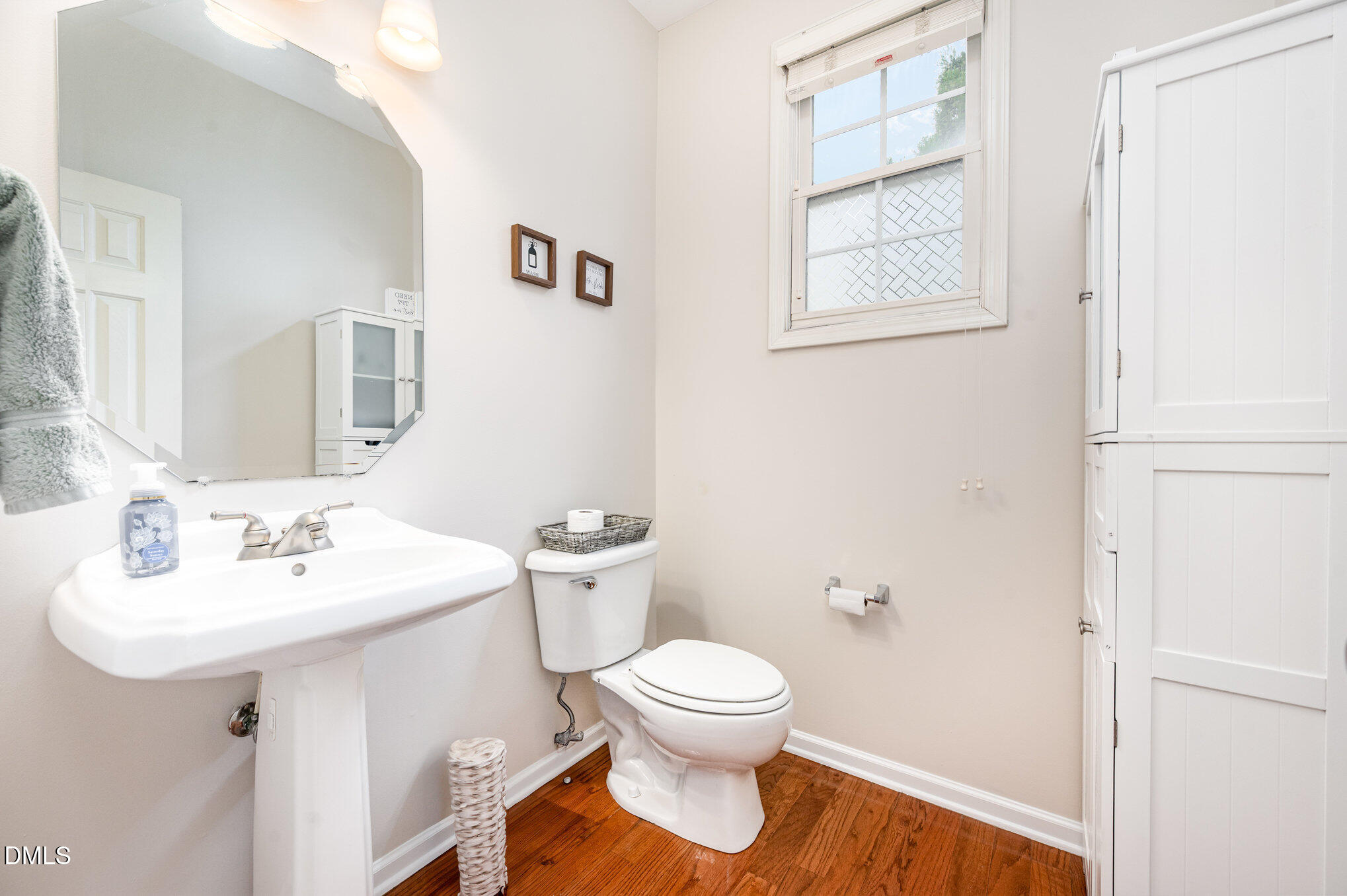 2116 Covered Bridge Court Raleigh, NC 27614 - Photo 31 of 36 a bathroom with a toilet sink and mirror