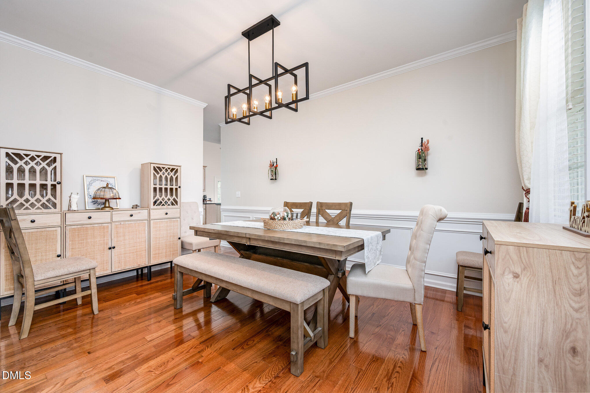 2116 Covered Bridge Court Raleigh, NC 27614 - Photo 9 of 36 a view of a dining room with furniture wooden floor and chandelier