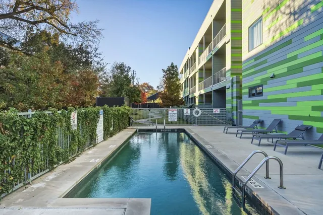 a view of a swimming pool with a patio