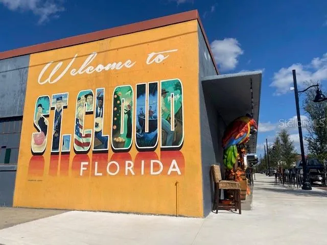 a view of a building with car parked