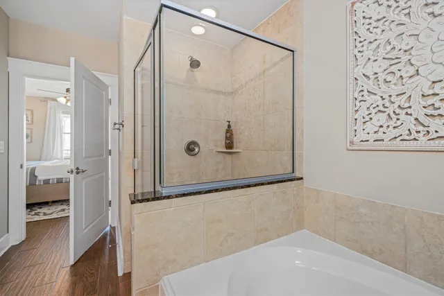 a utility room with closet and windows