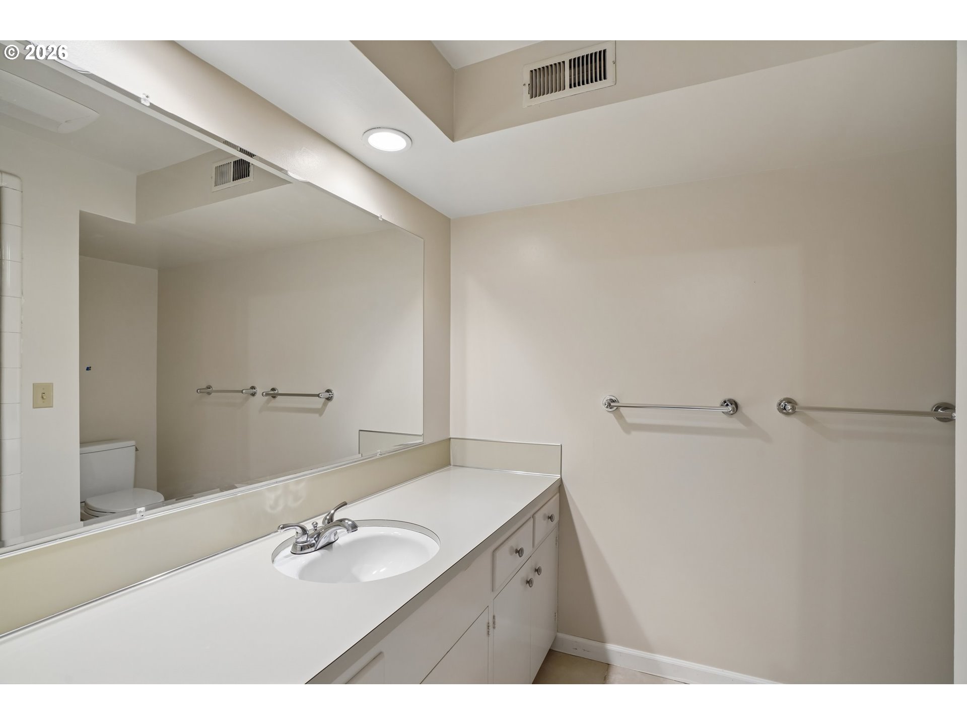 7600 Southwest Northvale Way Portland, OR 97225 - Photo 38 of 46 a bathroom with a double vanity sink and mirror