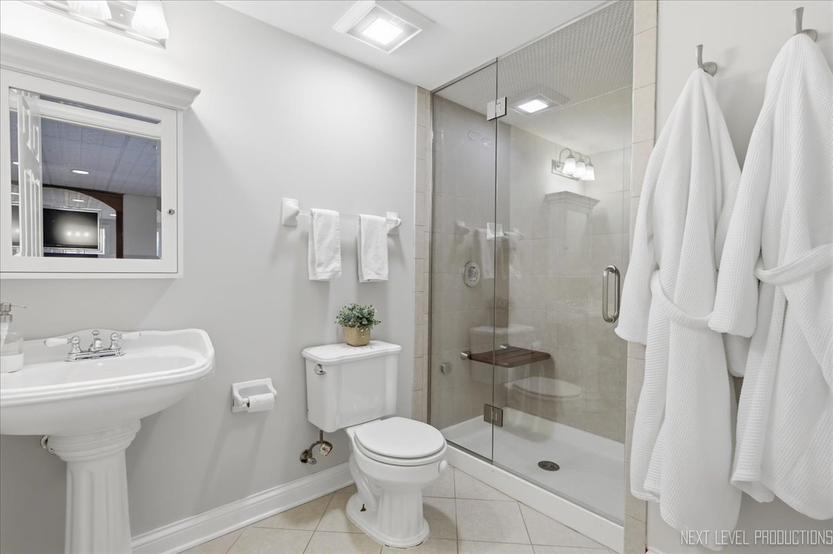 1914 North Ridge Avenue Arlington Heights, IL 60004 - Photo 36 of 50 a bathroom with a sink toilet and shower