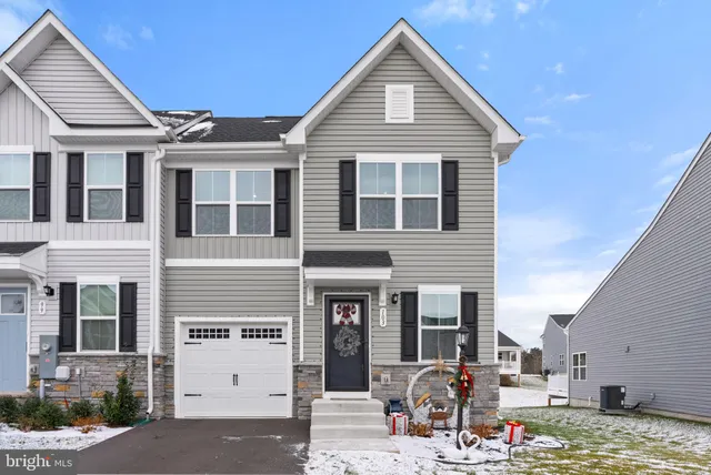 a front view of a house with glass windows