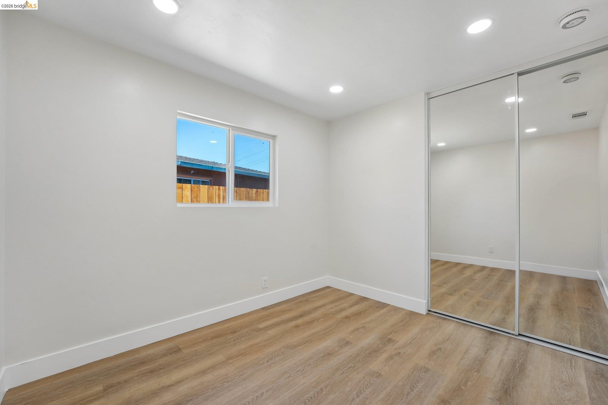 375 Senter Road San Jose, CA 95111 - Photo 41 of 80 a view of an empty room with wooden floor and a window