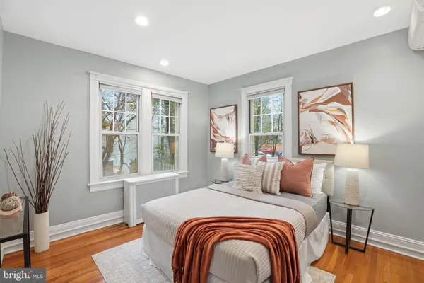 a bedroom with bed and a window