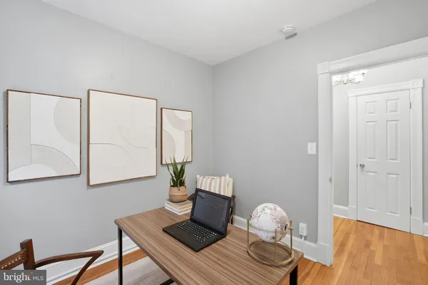 a room with furniture and wooden floor