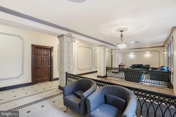 a lobby with furniture and wooden floor