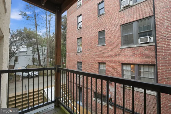 a view of a brick building from a balcony